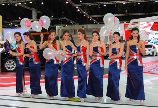 BANGKOK, THAILAND - MARCH 30, 2014: Unidentified female presenter pose in the 35th Bangkok International Motor Show on March 30, 2014 in Bangkok, Thailand.