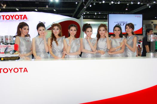 BANGKOK, THAILAND - MARCH 30, 2014: Unidentified female presenter pose in the 35th Bangkok International Motor Show on March 30, 2014 in Bangkok, Thailand.