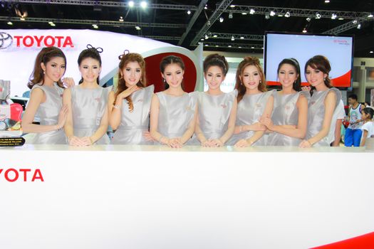 BANGKOK, THAILAND - MARCH 30, 2014: Unidentified female presenter pose in the 35th Bangkok International Motor Show on March 30, 2014 in Bangkok, Thailand.