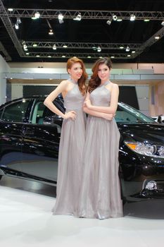 BANGKOK, THAILAND - MARCH 30, 2014: Unidentified female presenter pose in the 35th Bangkok International Motor Show on March 30, 2014 in Bangkok, Thailand.