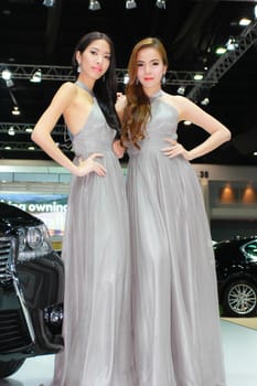 BANGKOK, THAILAND - MARCH 30, 2014: Unidentified female presenter pose in the 35th Bangkok International Motor Show on March 30, 2014 in Bangkok, Thailand.