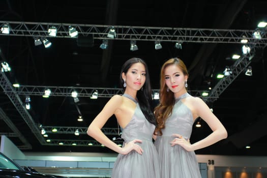 BANGKOK, THAILAND - MARCH 30, 2014: Unidentified female presenter pose in the 35th Bangkok International Motor Show on March 30, 2014 in Bangkok, Thailand.