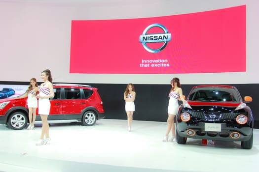 BANGKOK, THAILAND - MARCH 30, 2014: Unidentified female presenter pose in the 35th Bangkok International Motor Show on March 30, 2014 in Bangkok, Thailand.