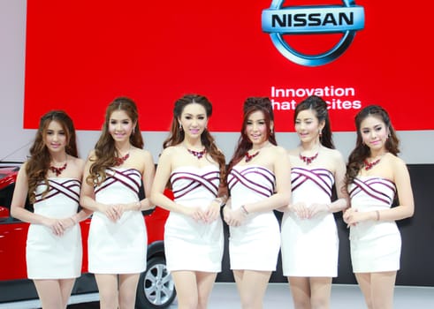 BANGKOK, THAILAND - MARCH 30, 2014: Unidentified female presenter pose in the 35th Bangkok International Motor Show on March 30, 2014 in Bangkok, Thailand.