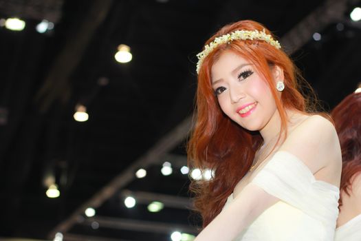 BANGKOK, THAILAND - MARCH 30, 2014: Unidentified female presenter pose in the 35th Bangkok International Motor Show on March 30, 2014 in Bangkok, Thailand.