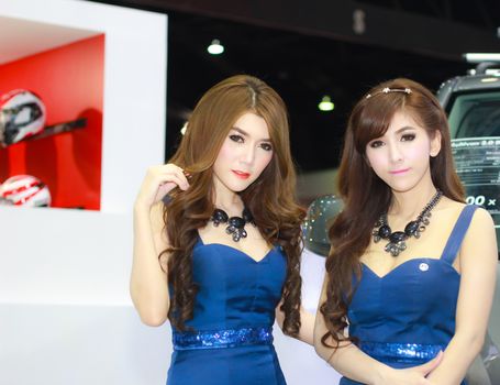 BANGKOK, THAILAND - MARCH 30, 2014: Unidentified female presenter pose in the 35th Bangkok International Motor Show on March 30, 2014 in Bangkok, Thailand.