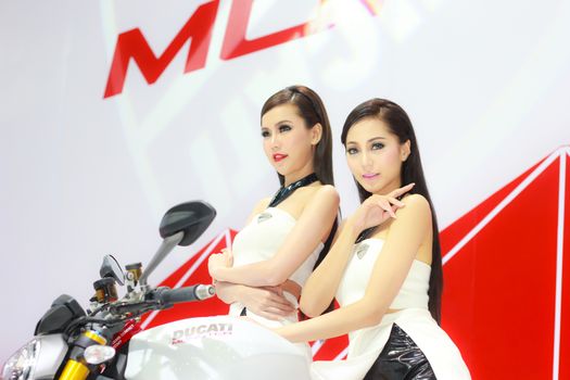 BANGKOK, THAILAND - MARCH 30, 2014: Unidentified female presenter pose in the 35th Bangkok International Motor Show on March 30, 2014 in Bangkok, Thailand.