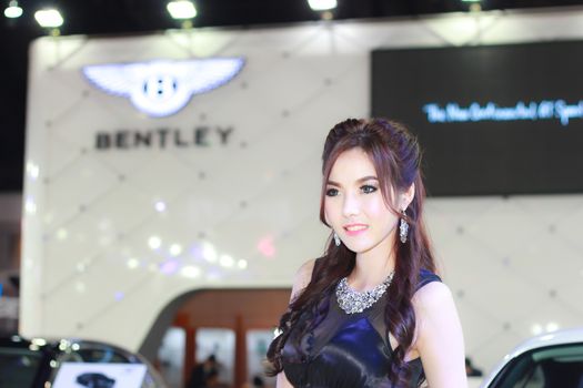 BANGKOK, THAILAND - MARCH 30, 2014: Unidentified female presenter pose in the 35th Bangkok International Motor Show on March 30, 2014 in Bangkok, Thailand.