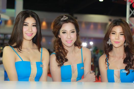 BANGKOK, THAILAND - MARCH 30, 2014: Unidentified female presenter pose in the 35th Bangkok International Motor Show on March 30, 2014 in Bangkok, Thailand.