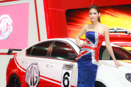 BANGKOK, THAILAND - MARCH 30, 2014: Unidentified female presenter pose in the 35th Bangkok International Motor Show on March 30, 2014 in Bangkok, Thailand.