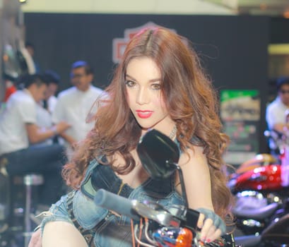 BANGKOK, THAILAND - MARCH 30, 2014: Unidentified female presenter pose in the 35th Bangkok International Motor Show on March 30, 2014 in Bangkok, Thailand.