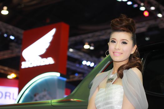 BANGKOK, THAILAND - MARCH 30, 2014: Unidentified female presenter pose in the 35th Bangkok International Motor Show on March 30, 2014 in Bangkok, Thailand.