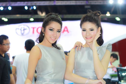 BANGKOK, THAILAND - MARCH 30, 2014: Unidentified female presenter pose in the 35th Bangkok International Motor Show on March 30, 2014 in Bangkok, Thailand.