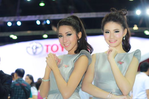 BANGKOK, THAILAND - MARCH 30, 2014: Unidentified female presenter pose in the 35th Bangkok International Motor Show on March 30, 2014 in Bangkok, Thailand.