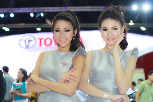 BANGKOK, THAILAND - MARCH 30, 2014: Unidentified female presenter pose in the 35th Bangkok International Motor Show on March 30, 2014 in Bangkok, Thailand.