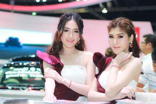 BANGKOK, THAILAND - MARCH 30, 2014: Unidentified female presenter pose in the 35th Bangkok International Motor Show on March 30, 2014 in Bangkok, Thailand.