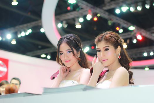 BANGKOK, THAILAND - MARCH 30, 2014: Unidentified female presenter pose in the 35th Bangkok International Motor Show on March 30, 2014 in Bangkok, Thailand.