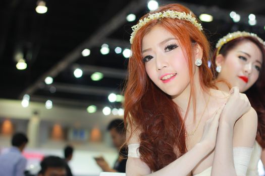 BANGKOK, THAILAND - MARCH 30, 2014: Unidentified female presenter pose in the 35th Bangkok International Motor Show on March 30, 2014 in Bangkok, Thailand.