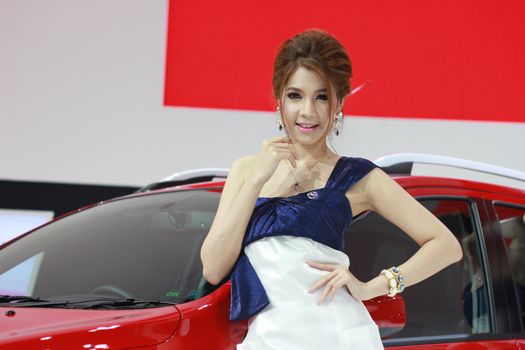 BANGKOK, THAILAND - MARCH 30, 2014: Unidentified female presenter pose in the 35th Bangkok International Motor Show on March 30, 2014 in Nonthaburi, Thailand.