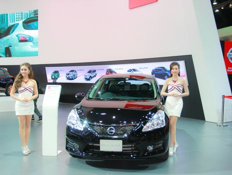 BANGKOK, THAILAND - MARCH 30, 2014: Unidentified female presenter pose in the 35th Bangkok International Motor Show on March 30, 2014 in Bangkok, Thailand.