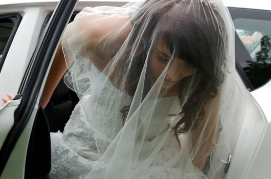 Beautiful South African bride leaving car on way to wedding