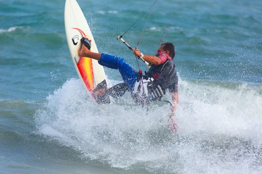 MUI NE, VIETNAM - JANUARY 28, 2014: Unidentified kitesurfer at Mui Ne resort beach on January 28, 2014 in Mui Ne resort, Vietnam