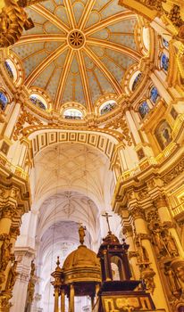 Basilica Dome Stained Glass Baptisim Fount Cathedral Andalusia Grandada Spain.  Built in the 1500s, housing the tombs of King Ferdinand and Isabella.  Dome by Diego de Siloe, 16th Century Stained Glass by Juan del Campo.