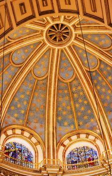 Basilica Dome Stained Glass Cathedral Andalusia Granada Spain.  Built in the 1500s, housing the tombs of King Ferdinand and Isabella.  Dome by Diego de Siloe, 16th Century Stained Glass by Juan del Campo.