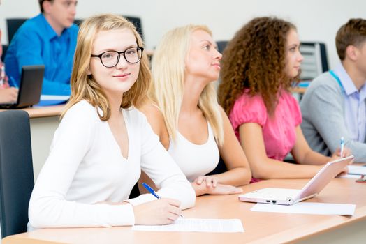 image of a young female students in the classroom, teaching at the University of