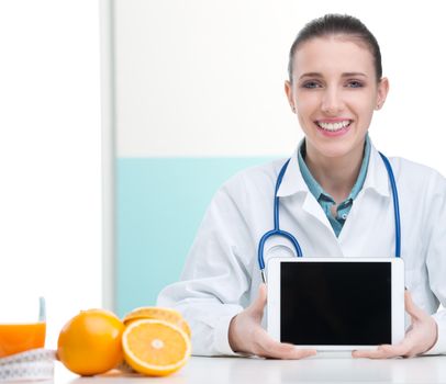 A portrait of cheerful healthcare professional promoting healthy eating