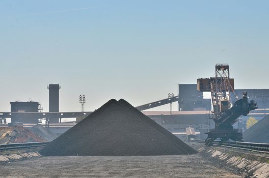 a huge coal loading conveyor belt piles coal