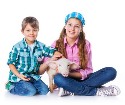 Little farmers. Cute gir and boyl with pig. Isolated on white background.