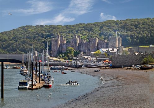 Conwy estuary harbour and 13th century castle in Wales UK.