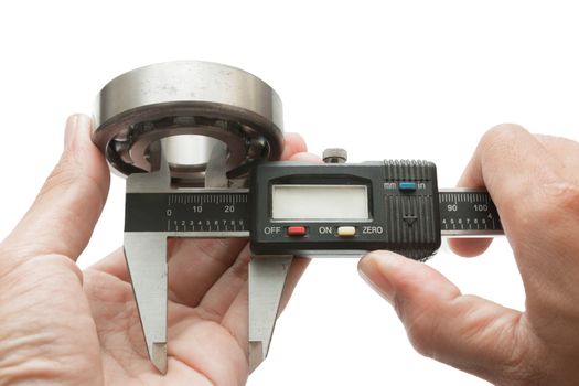 Metal vernier caliper and Ball bearings on white background