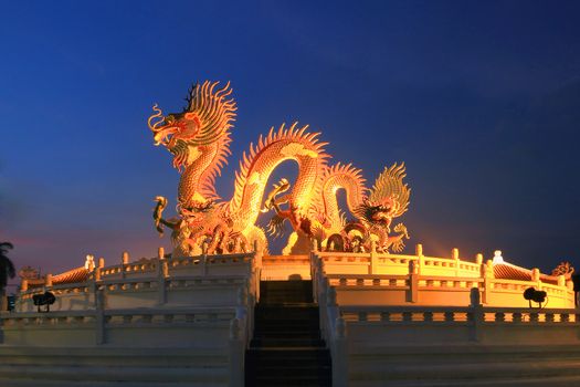 Chinese dragon statue at the twilight time