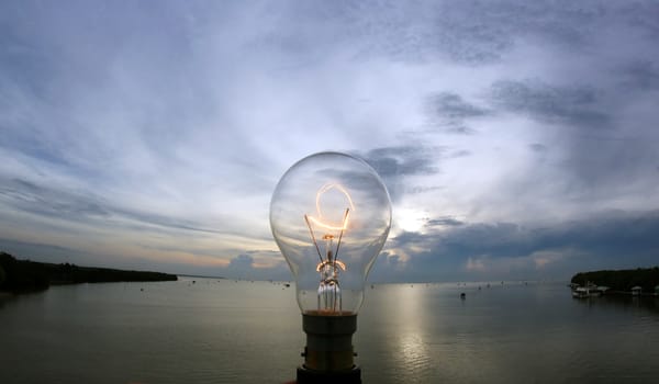 the lightbulb on beautiful sky background