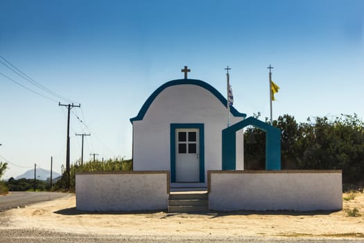 A simple Greek chapel on a sunny day