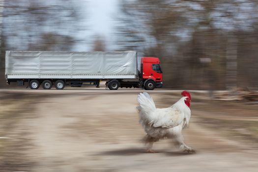 The truck quickly moves on the highway on the greased background