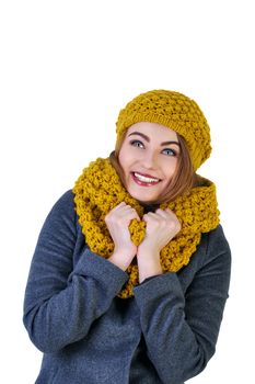 Young attractive Frenchwoman in knitted hat and scarf isolated on white background