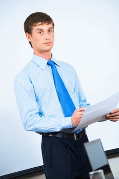 image of a businessman in the office with business papers