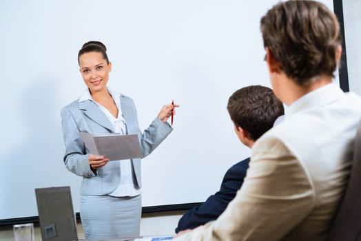 image of a discusses business woman with colleagues