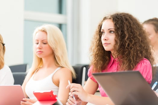 image of a young female student in the classroom, teaching at the University of