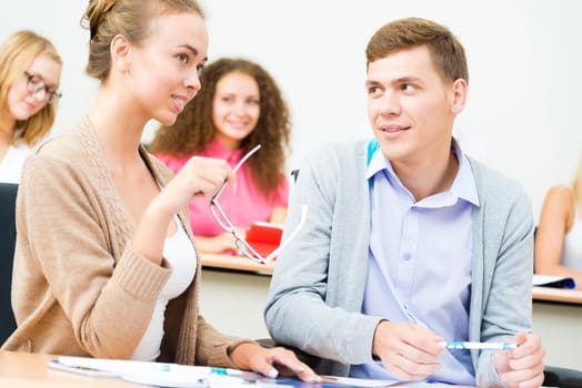 image of a two students in the class talk