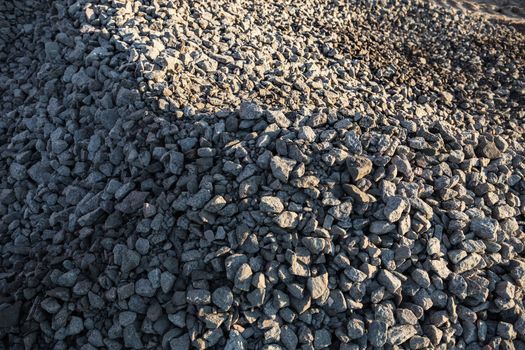 Pile of crushed stones in the sunny day.