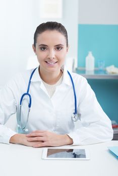 Portrait of a beautiful young female doctor in office