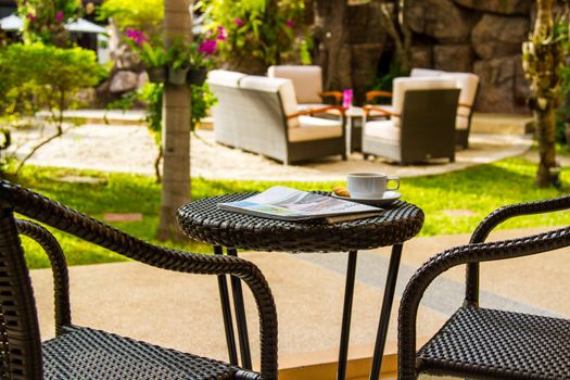 Coffee and newspaper on table for relax