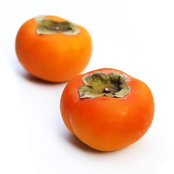 Ripe persimmon fruit isolated on white background