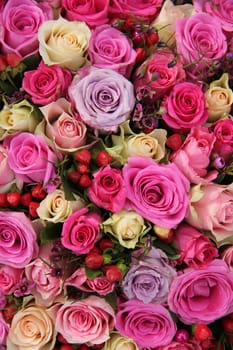 Pink and purple roses in a big wedding centerpiece