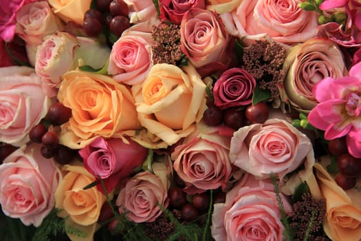 Pastel roses in different shades of pink in a bridal arrangement