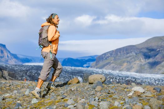 Young woman tourist on the lava field at Landmannalaugar, Iceland